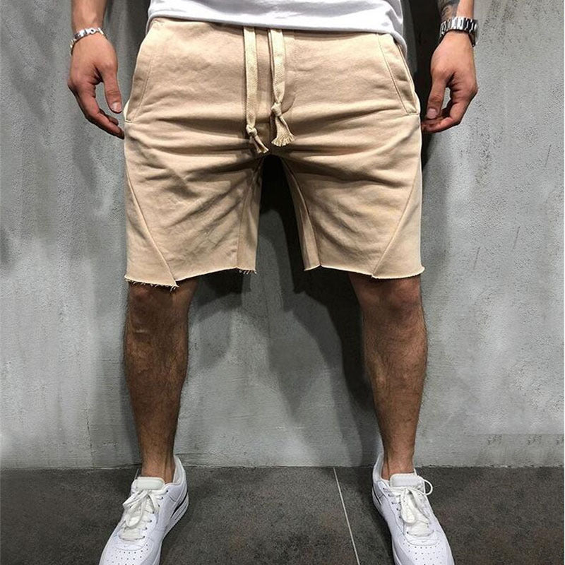 A man wearing cream color ActiveFlex Summer Gym Shorts  a product from mensathletix the best Men athletic shorts Gym shorts Mens running shorts Crossfit shorts Sports shorts sports shorts for men Men gym shorts