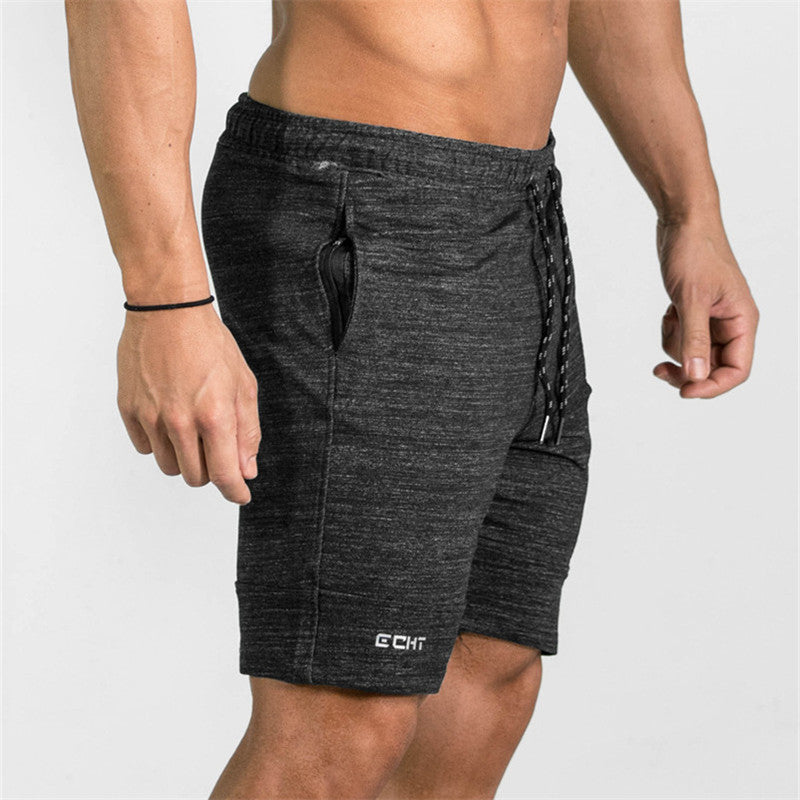 A man wearing ash color ATHX Summer Gym Zip Shorts a product from mensathletix the best Men athletic shorts Gym shorts Mens running shorts Crossfit shorts Sports shorts sports shorts for men gym shorts