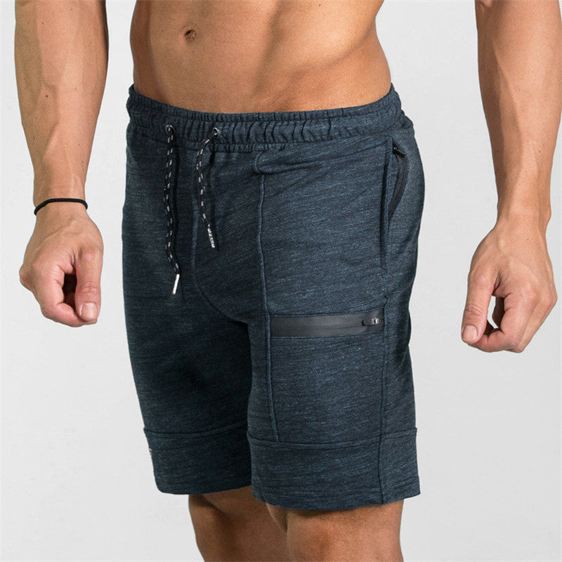 A man wearing ash color ATHX Summer Gym Zip Shorts a product from mensathletix the best Men athletic shorts Gym shorts Mens running shorts Crossfit shorts Sports shorts sports shorts for men gym shorts