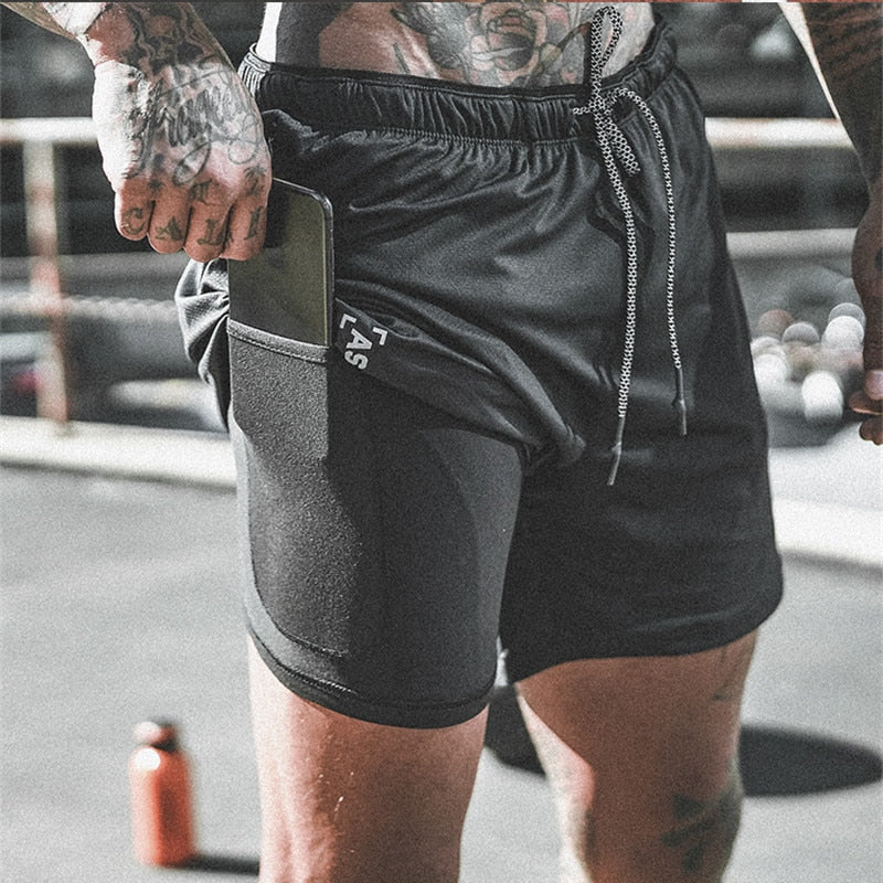 A man wearing black color ATHX ForceFit Performance Short a product from mensathletix the best Men athletic shorts Gym shorts Mens running shorts Crossfit shorts Sports shorts sports shorts for Men gym shorts