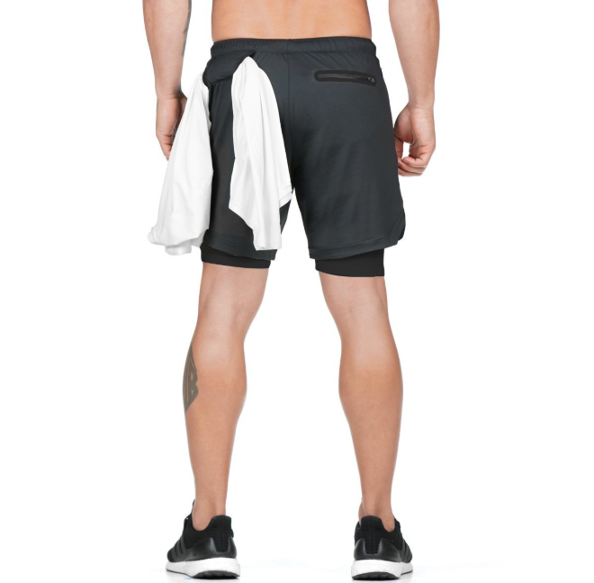 A man wearing black color ATHX DualSport Fitness Shorts a product from mensathletix the best Men athletic shorts Gym shorts Mens running shorts Crossfit shorts Sports shorts sports shorts for Men gym shorts