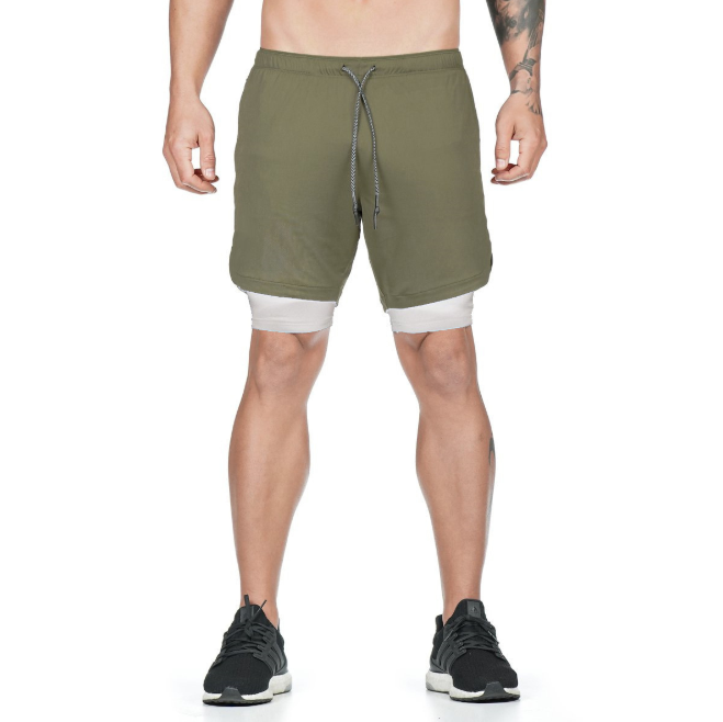 A man wearing army green color ATHX DualSport Fitness Shorts a product from mensathletix the best Men athletic shorts Gym shorts Mens running shorts Crossfit shorts Sports shorts sports shorts for Men gym shorts