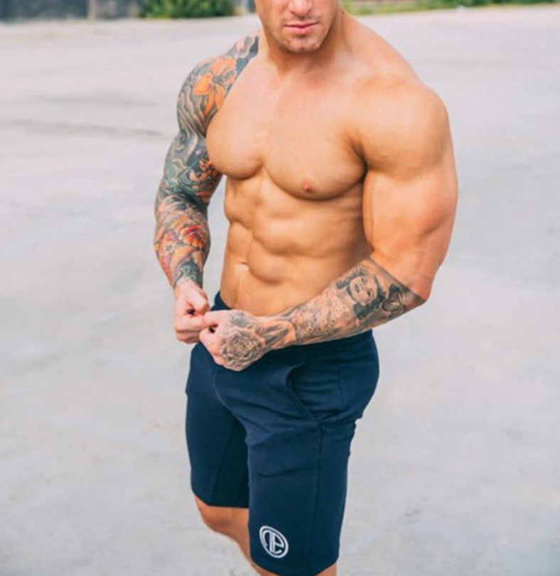 A man wearing navy blue color Casual men's shorts outdoor fitness pants a product from mensathletix the best Men athletic shorts Gym shorts Mens running shorts Crossfit shorts Sports shorts sports shorts for men  gym shorts