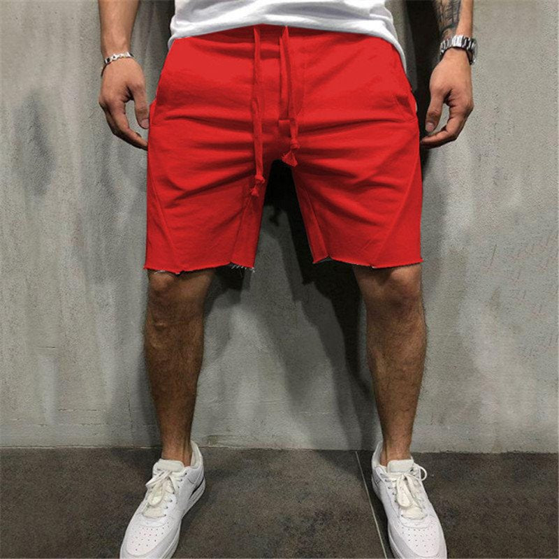 A man wearing red color ActiveFlex Summer Gym Shorts a product from mensathletix the best Men athletic shorts Gym shorts Mens running shorts Crossfit shorts Sports shorts sports shorts for men Men gym shorts