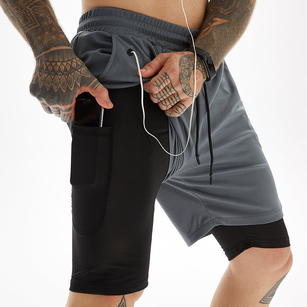 A man wearing black and ash color ATHX CottonFit 5-Point Shorts a product from mensathletix the best Men athletic shorts Gym shorts Mens running shorts Crossfit shorts Sports shorts sports shorts for Men gym shorts