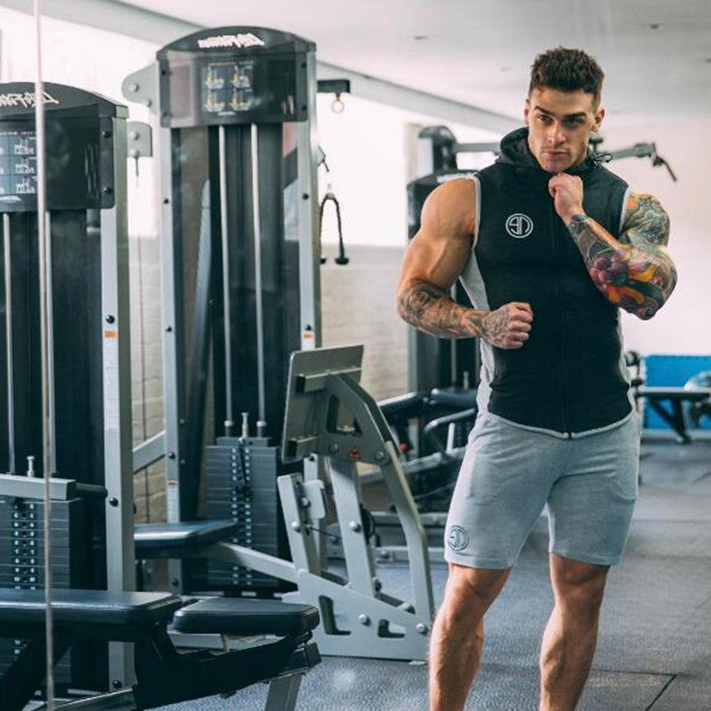 A man wearing ash color Casual men's shorts outdoor fitness pants a product from mensathletix the best Men athletic shorts Gym shorts Mens running shorts Crossfit shorts Sports shorts sports shorts for men gym shorts