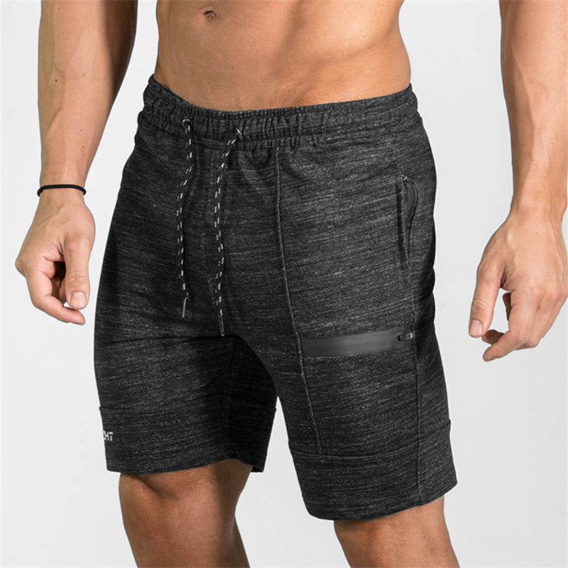 A man wearing ash color ATHX Summer Gym Zip Shorts a product from mensathletix the best Men athletic shorts Gym shorts Mens running shorts Crossfit shorts Sports shorts sports shorts for men gym shorts