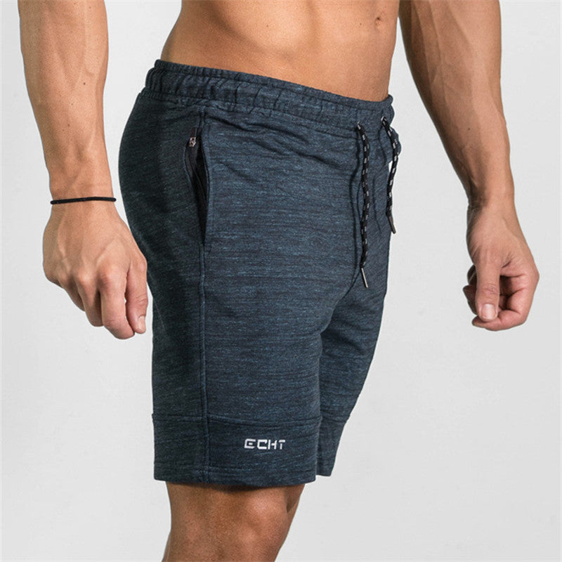 A man wearing ash color ATHX Summer Gym Zip Shorts a product from mensathletix the best Men athletic shorts Gym shorts Mens running shorts Crossfit shorts Sports shorts sports shorts for men gym shorts