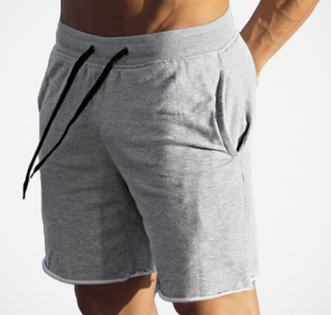 A man wearing ash color Cotton Workout Shorts For Men a product from mensathletix the best Men athletic shorts Gym shorts Mens running shorts Crossfit shorts Sports shorts sports shorts for men gym shorts