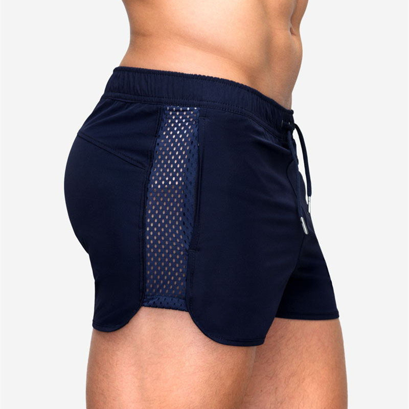 A man wearing black color ATHX EuroSport Surf Shorts a product from mensathletix the best Men athletic shorts Gym shorts Mens running shorts Crossfit shorts Sports shorts sports shorts for Mengym shorts