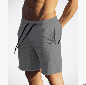 A man wearing ash color Cotton Workout Shorts For Men a product from mensathletix the best Men athletic shorts Gym shorts Mens running shorts Crossfit shorts Sports shorts sports shorts for men  gym shorts