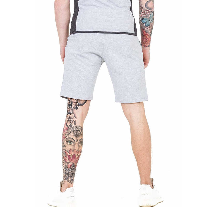 A man wearing ash color Casual men's shorts outdoor fitness pants a product from mensathletix the best Men athletic shorts Gym shorts Mens running shorts Crossfit shorts Sports shorts sports shorts for men gym shorts