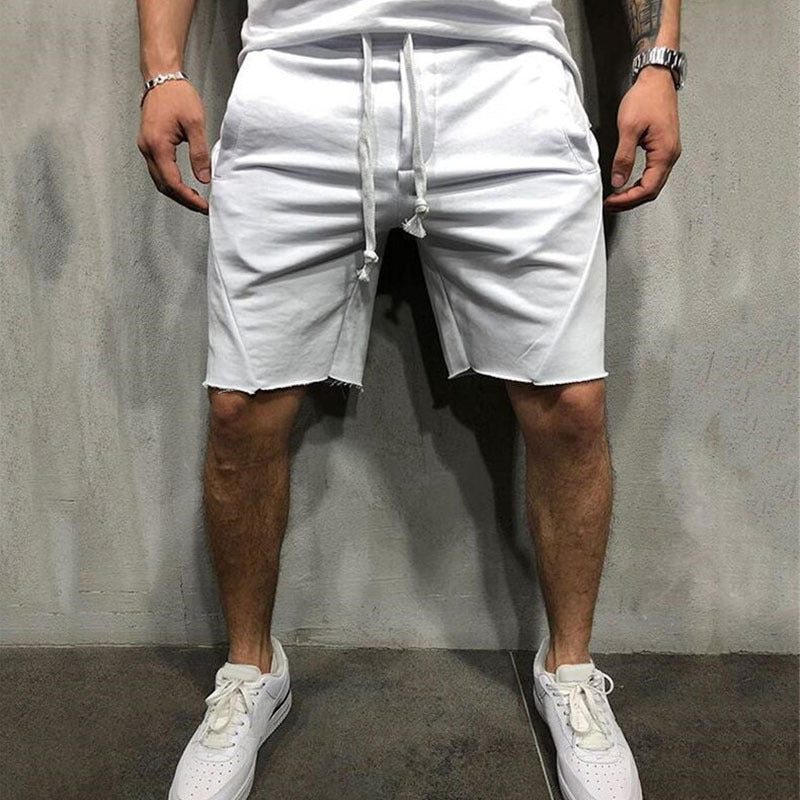 A man wearing white color ActiveFlex Summer Gym Shorts a product from mensathletix the best Men athletic shorts Gym shorts Mens running shorts Crossfit shorts Sports shorts sports shorts for men Men gym shorts