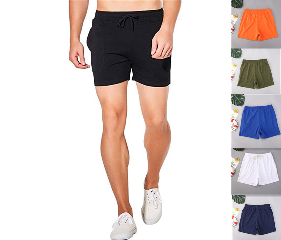 A man wearing black color Beach Style Men's Swimming Shorts Solid Color Shorts Men a product from mensathletix the best Men athletic shorts Gym shorts Mens running shorts Crossfit shorts Sports shorts sports shorts for men gym shorts