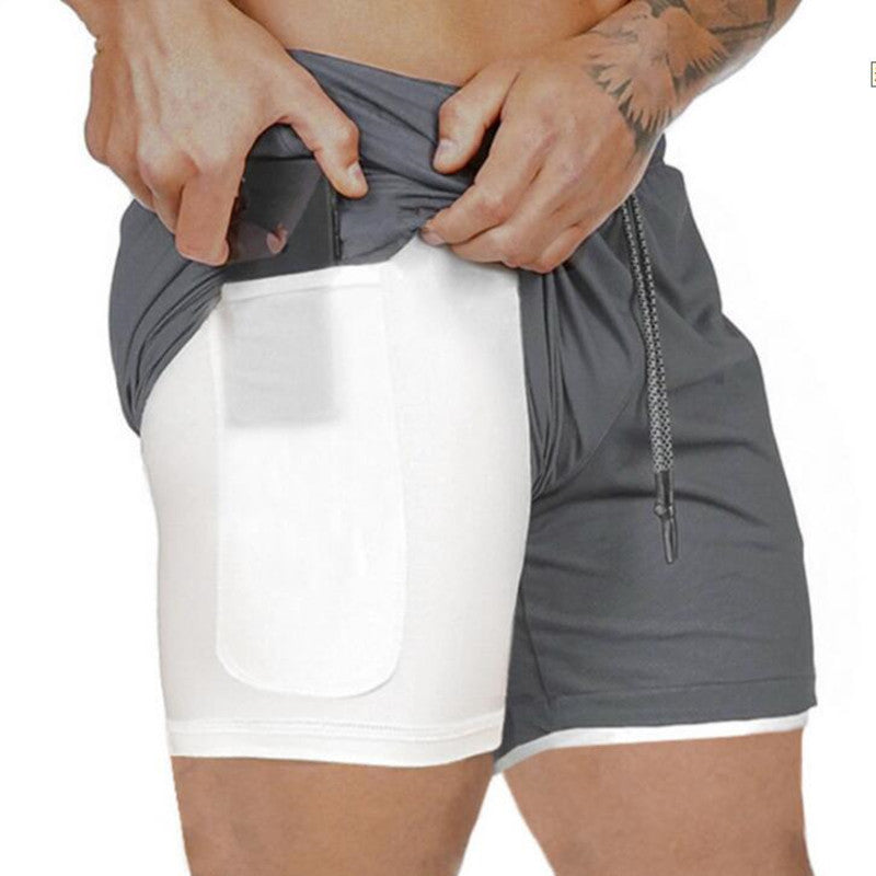 A man wearing ash with white color ATHX ForceFit Performance Short a product from mensathletix the best Men athletic shorts Gym shorts Mens running shorts Crossfit shorts Sports shorts sports shorts for Men gym shorts