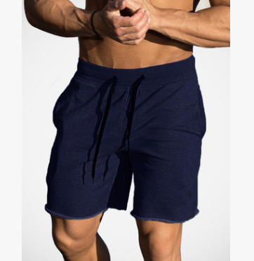 A man wearing navy blue color Cotton Workout Shorts For Men a product from mensathletix the best Men athletic shorts Gym shorts Mens running shorts Crossfit shorts Sports shorts sports shorts for men gym shorts