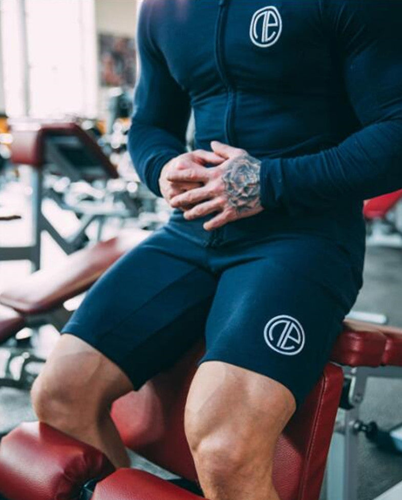 A man wearing navy blue color Casual men's shorts outdoor fitness pants a product from mensathletix the best Men athletic shorts Gym shorts Mens running shorts Crossfit shorts Sports shorts sports shorts for men  gym shorts