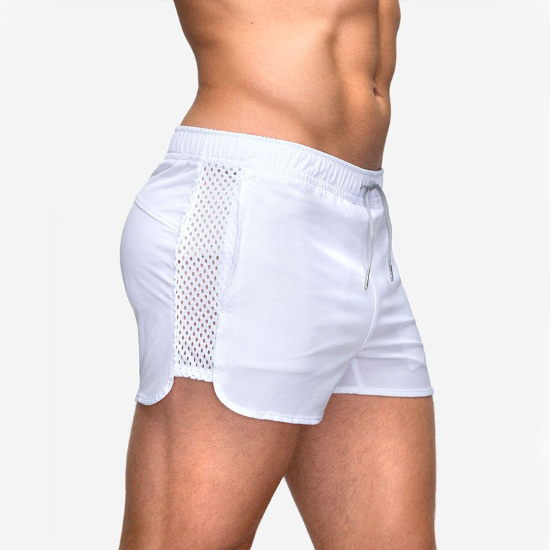 A man wearing white color ATHX EuroSport Surf Shorts a product from mensathletix the best Men athletic shorts Gym shorts Mens running shorts Crossfit shorts Sports shorts sports shorts for Men gym shorts