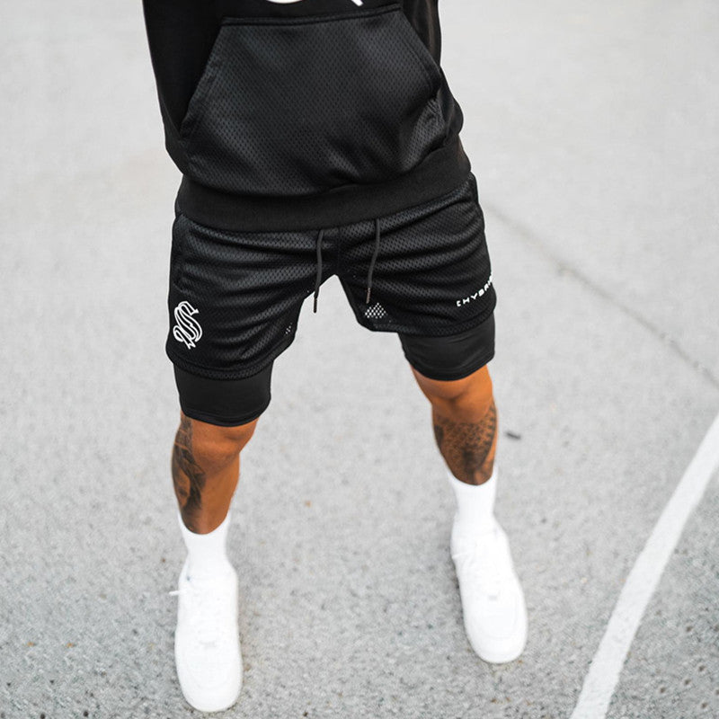 A man wearing black color ATHX DoubleFlex Sport Shorts a product from mensathletix the best Men athletic shorts Gym shorts Mens running shorts Crossfit shorts Sports shorts sports shorts for Men gym shorts