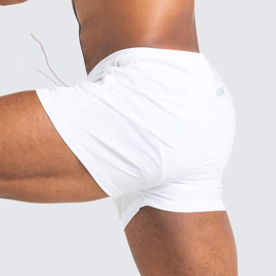 A man wearing white color ATHX New Running Shorts a product from mensathletix the best Men athletic shorts Gym shorts Mens running shorts Crossfit shorts Sports shorts sports shorts for men gym shorts