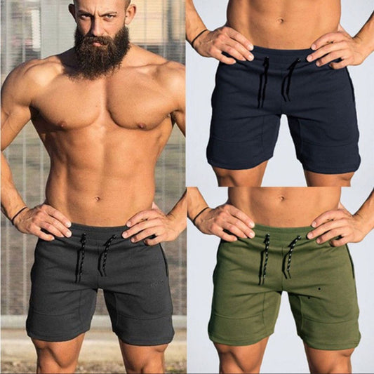 A man wearing ash, navy blue and army green color Casual Drawstring Shorts a product from mensathletix the best Men athletic shorts Gym shorts Mens running shorts Crossfit shorts Sports shorts sports shorts for men gym shorts