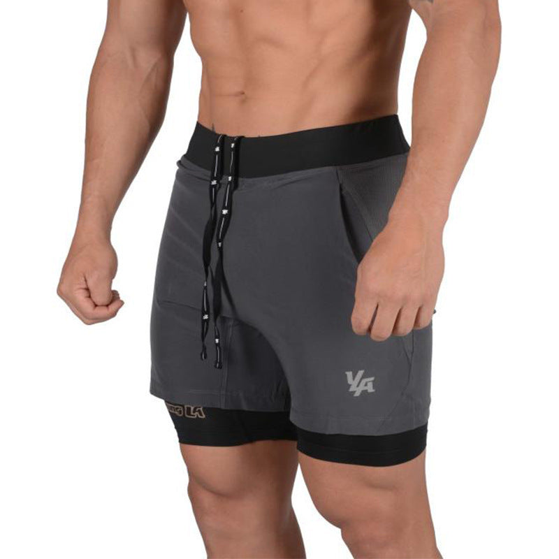 A man wearing black color ATHX 2-in-1 Gym Run Shorts a product from mensathletix the best Men athletic shorts Gym shorts Mens running shorts Crossfit shorts Sports shorts sports shorts for men Men gym shorts