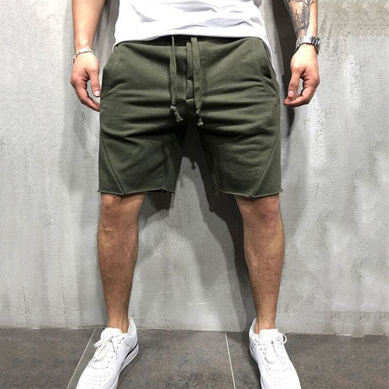 A man wearing army green ActiveFlex Summer Gym Shorts   a product from mensathletix the best Men athletic shorts Gym shorts Mens running shorts Crossfit shorts Sports shorts sports shorts for men Men gym shorts