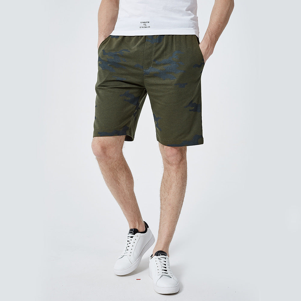 A man wearing army green color ATHX Camo Trend Shorts a product from mensathletix the best Men athletic shorts Gym shorts Mens running shorts Crossfit shorts Sports shorts sports shorts for Men gym shorts