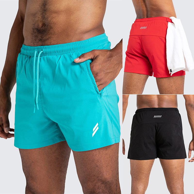 A man wearing red, sky blue and black color ATHX New Running Shorts a product from mensathletix the best Men athletic shorts Gym shorts Mens running shorts Crossfit shorts Sports shorts sports shorts for men gym shorts