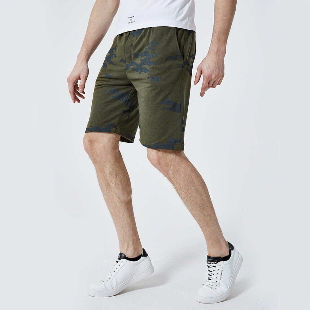 A man wearing army green color ATHX Camo Trend Shorts a product from mensathletix the best Men athletic shorts Gym shorts Mens running shorts Crossfit shorts Sports shorts sports shorts for Men gym shorts