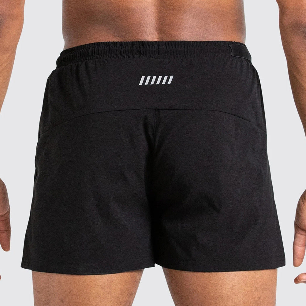 A man wearing black color ATHX New Running Shorts a product from mensathletix the best Men athletic shorts Gym shorts Mens running shorts Crossfit shorts Sports shorts sports shorts for men gym shorts