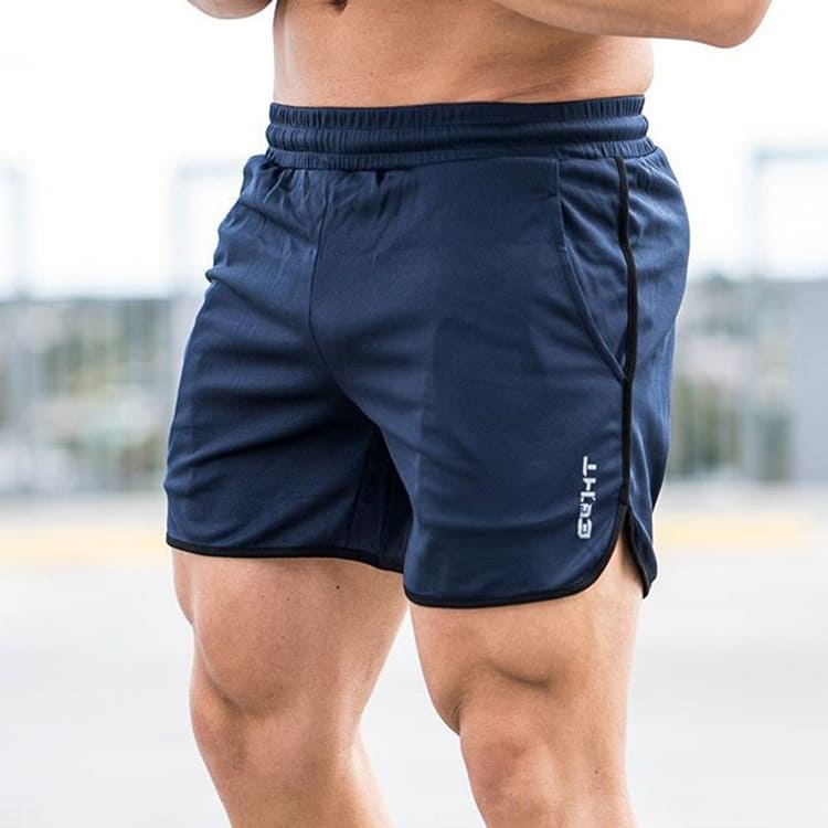 A man wearing navy blue color ATHX GymPro Shorts a product from mensathletix the best Men athletic shorts Gym shorts Mens running shorts Crossfit shorts Sports shorts sports shorts for Men  gym shorts