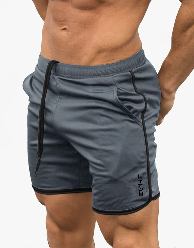 A man wearing ash color ATHX GymPro Shorts a product from mensathletix the best Men athletic shorts Gym shorts Mens running shorts Crossfit shorts Sports shorts sports shorts for Men gym shorts