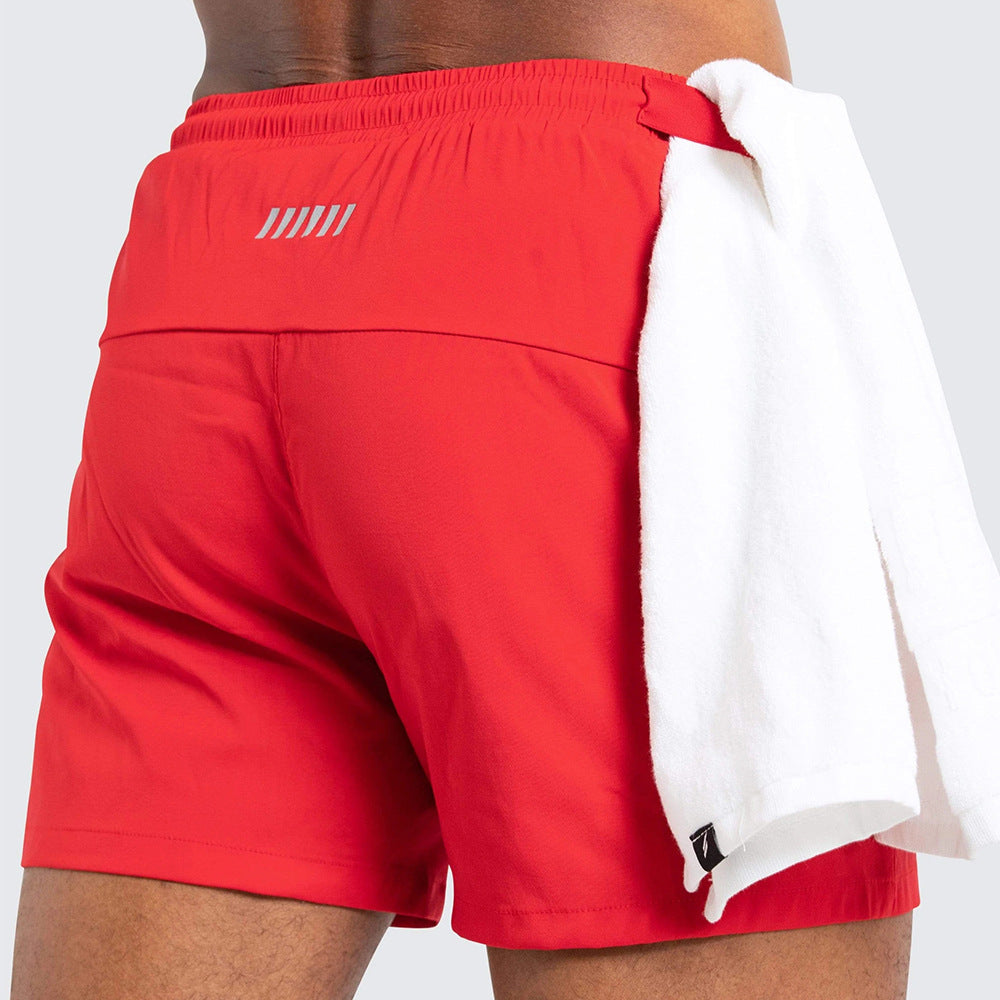 A man wearing red color ATHX New Running Shorts a product from mensathletix the best Men athletic shorts Gym shorts Mens running shorts Crossfit shorts Sports shorts sports shorts for men  gym shorts